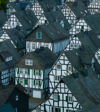 Aerial view of historic half-timbered houses in a beautiful village at sunrise, Freudenberg, Germany.
