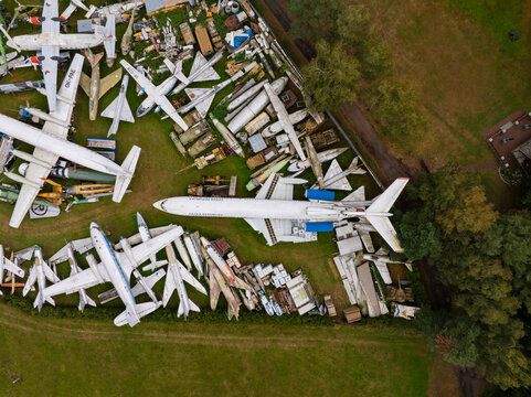 Aerial view of an abandoned airplane and helicopter graveyard with rusty metal aircraft collection, Zruc Senec, Czech Republic.