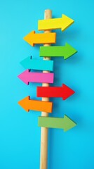 Colorful Directional Signs Against Blue Background