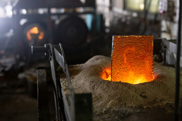 Ferrous metal billet is melted in an induction furnace closeup