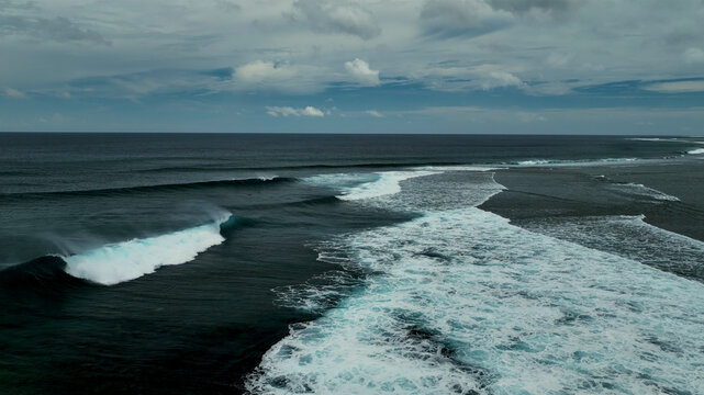 Aerial view of beautiful waves and reef in tropical ocean, Eastern Fiji.