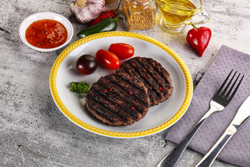 Grilled burger cutlet with sauce