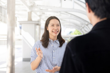 Fototapeta premium close up businesswoman explaining and brief detail of company's marketing research report on tablet to businessman before go to join meeting conference event , new business and startup concept
