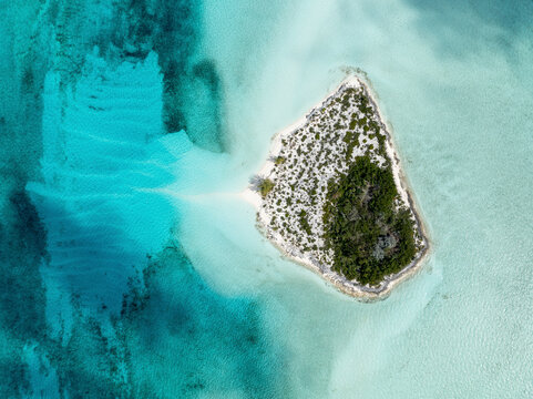 Aerial view of a pristine tropical island with turquoise water and beautiful beach, South Eleuthera, The Bahamas.