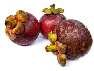 Purple Mangosteens isolated on white background, Fresh highest variety Mangosteens on White Background With clipping path.