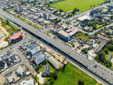Aerial view of bustling gra junction with modern buildings and busy highways, Port Harcourt, Nigeria.