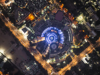Aerial view of vibrant cityscape with bustling traffic and illuminated buildings at night, Ajmeri Gate, New Delhi, India.