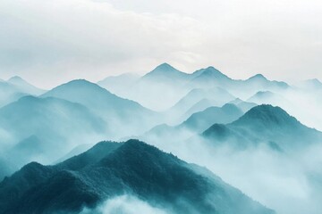 Serene mountain landscape shrouded in mist and soft blue hues.