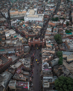 Aerial view of bustling Kote Gate with crowded streets and vibrant buildings, Bikaner, India.