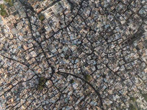 Aerial view of vibrant and intricate urban landscape with historic architecture and crowded streets, Bhistiyon Ka Bas, Jodhpur, Rajasthan, India.
