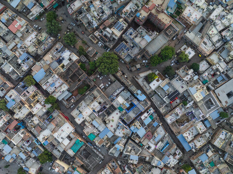 Aerial view of colorful rooftops and bustling streets in the blue city, Jodhpur, India.
