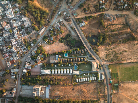 Aerial view of beautiful urban landscape with buildings, roads, and greenery, Pushkar, India.
