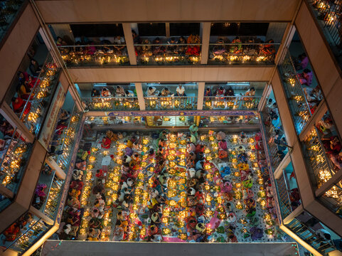 Aerial view of the vibrant kartik vrata festival with illuminated candles and a gathering of people, Gendaria, Dhaka, Bangladesh.