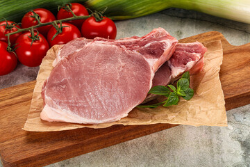 Raw pork steak loin with bone