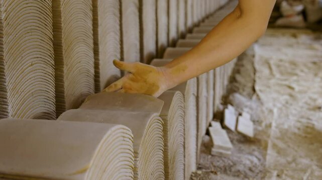 A scene of traditional Vietnamese roof tile making