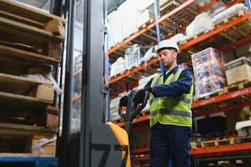 portrait of a smiling young warehouse worker working in a cash and carry wholesale store