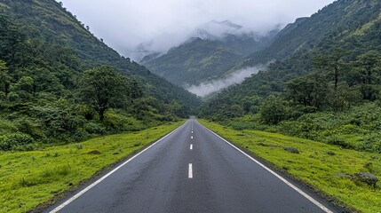 Serene Mountain Road Shrouded in Fog, Aerial road mountain fog and green concept.
