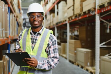 portrait of a young african american warehouse worker working in a cash and carry wholesale store