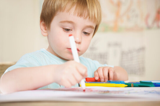 Boy drawing and coloring

