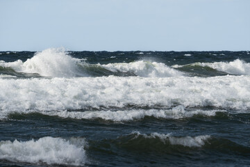 Naklejka premium The restless Baltic Sea. Waves with white crests off the coast of Estonia.