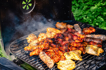 grilled meat over the coals on barbecue