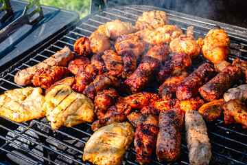 grilled meat over the coals on barbecue