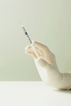 Hand Holding Syringe
