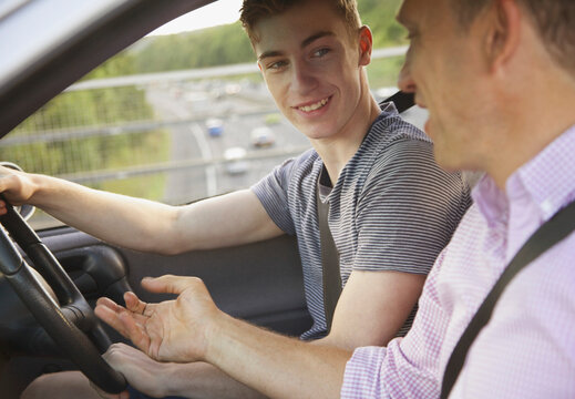 Father Teaching Son to Drive
