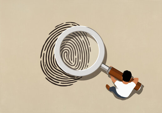View from above man holding large magnifying glass over fingerprint on beige background

