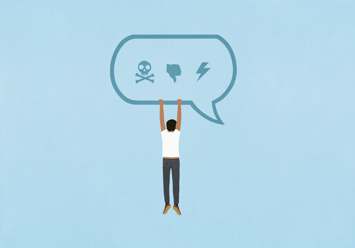 Man hanging from text message speech bubble with negative icons
