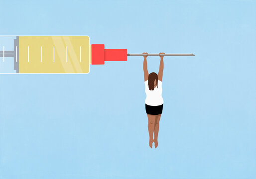 Woman hanging from large syringe on blue background
