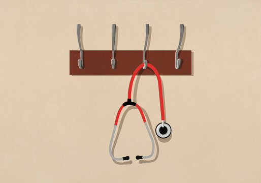 Stethoscope hanging from coat rack
