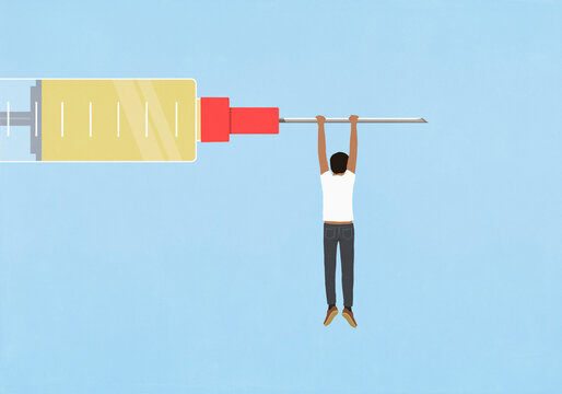 Man hanging from large syringe on blue background
