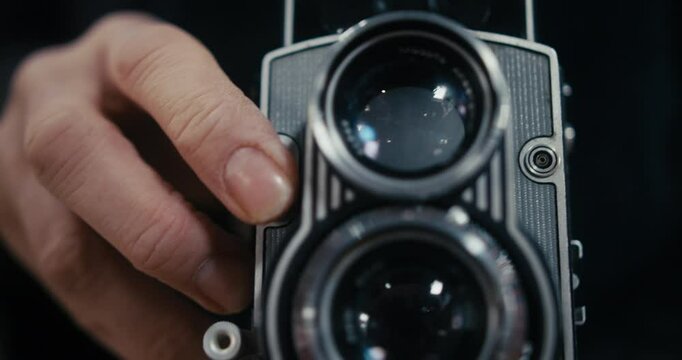 Extreme close up of the two lenses of a vintage film camera.