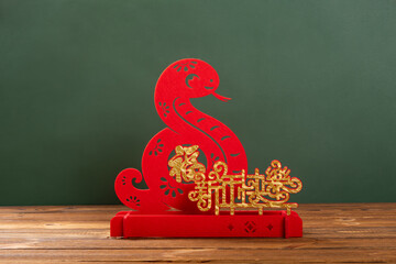 Chinese New Year of Snake mascot translation of the Chinese characters are fortune and happy...