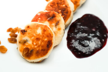 Classic homemade cheesecake with jam. Tasty homemade fried cheesecake. Dessert.