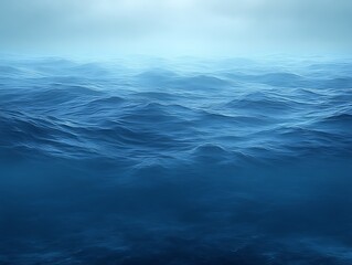 Fototapeta premium Calm ocean waves under a hazy sky.
