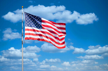 United States of America flag waving on a blue and sunny sky
