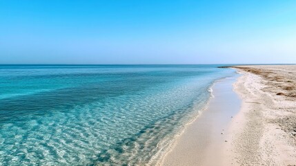 Fototapeta premium Serene Beach Scene: Azure Waters and Pristine Sand