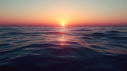 Fototapeta premium Sunset over calm ocean waters creating a tranquil atmosphere at twilight
