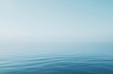 Obraz premium A simple blue background with a subtle white mist or fog effect