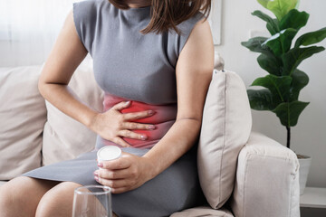 woman suffering from abdominal cramps and diarrhea, potential symptoms of Gastroenteritis or Helicobacter pylori infection