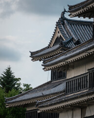 Fototapeta premium Close up to Matusmoto Castle where the roof details aver visible