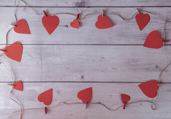 A wooden frame with a red heart pattern