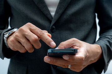 Businessman hands using smartphone for business
