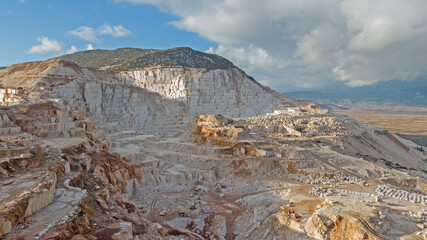 Aerial panorama of marble quarries in Burdur, Turkey. Marble quarry top view. Marble quarry in high altitude mountains.