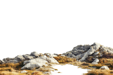 Natural rocky landscape featuring large stones and dry grass under a clear sky, perfect for environmental themes or outdoor adventures.