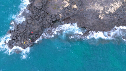 A drone shot of the beautiful sea scenery of Jeju Island, Korea, which boasts a green emerald...