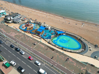 Fototapeta premium Beautiful and Attractive British Tourist Attraction and Downtown and Central Brighton seaside resort and Beach City of East Sussex, England GB. Footage Captured with Drone's Camera on May 9th, 2024