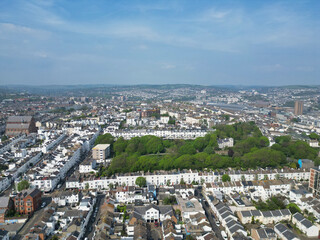 Fototapeta premium Beautiful and Attractive British Tourist Attraction and Downtown and Central Brighton seaside resort and Beach City of East Sussex, England GB. Footage Captured with Drone's Camera on May 9th, 2024